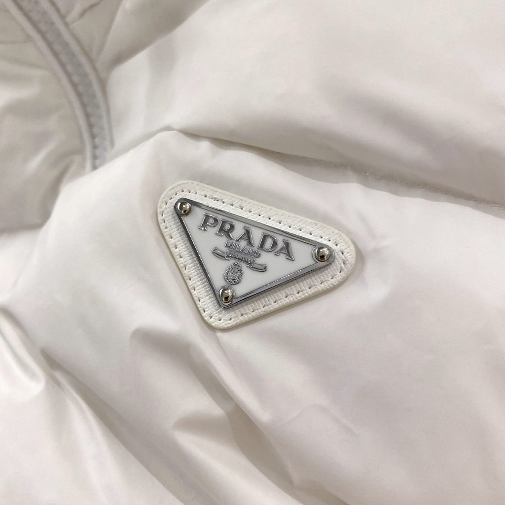 Prada Quilted Triangle Badge Puffer Jacket — detail