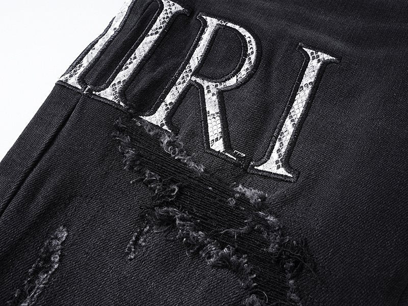 AMIRI Distressed Slim Tapered Jeans — detail
