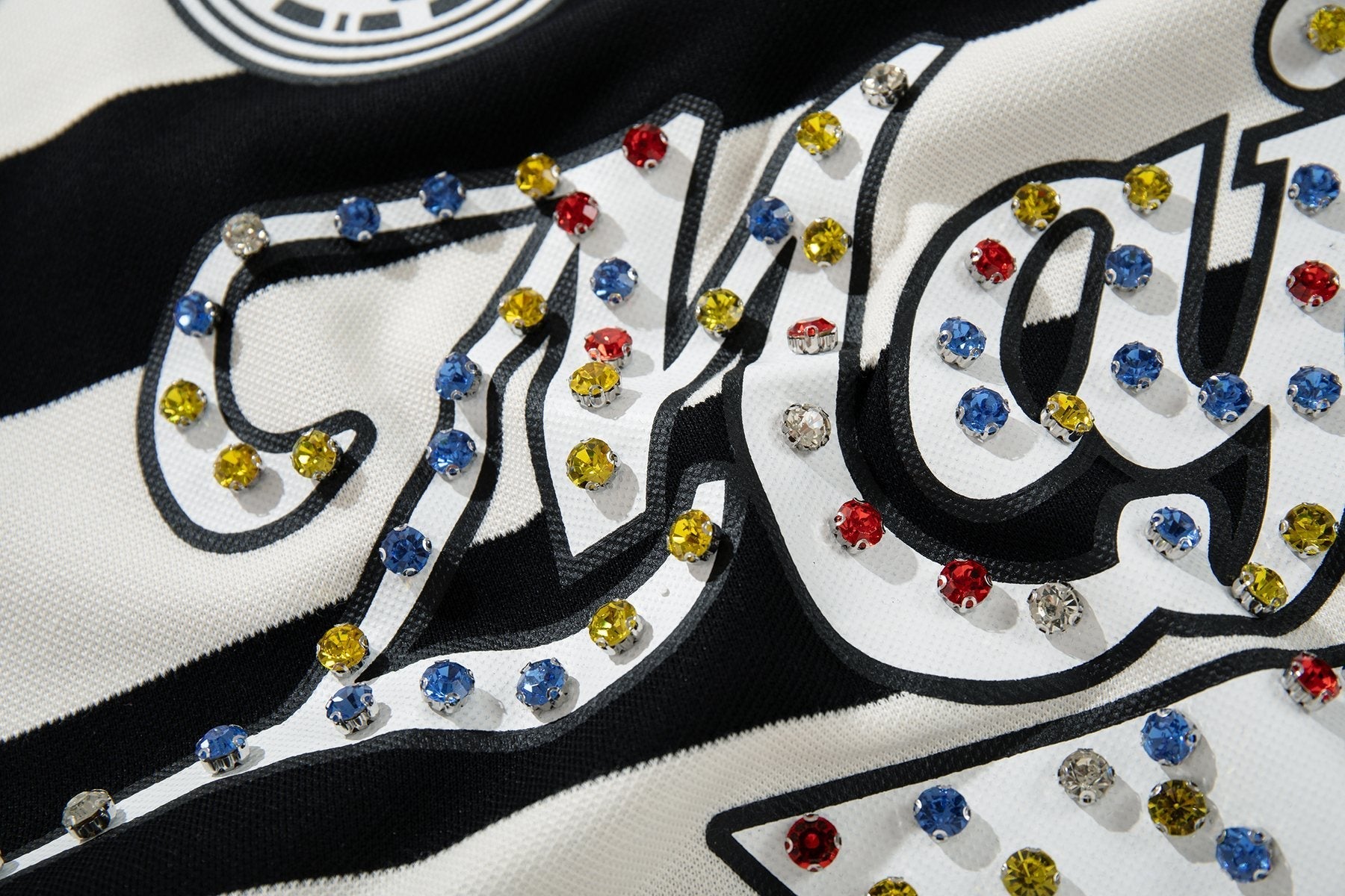 MAJESTIK Striped Crest Graphic Polo Shirt — detail